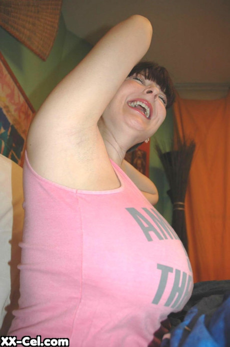 Dark haired amateur Lorna Morgan shows her humongous boobies and stretches her ass
