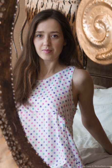 Brunette hottie with tiny boobies Lisa Carry strips and shows her fur pie