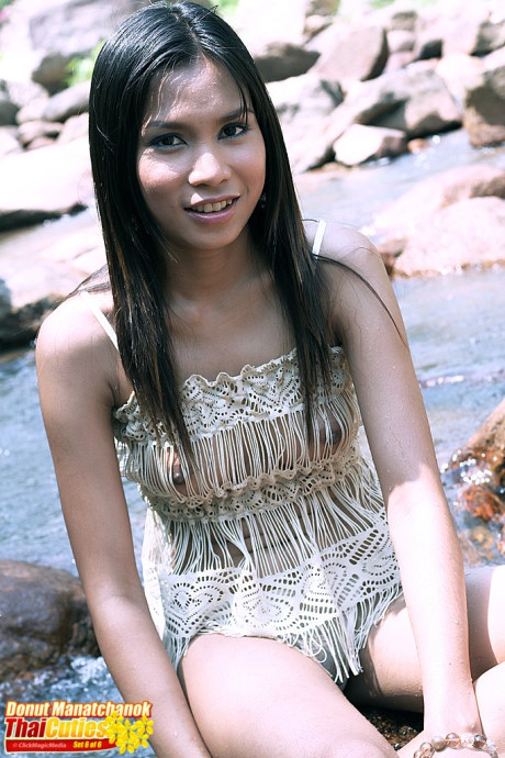 Attractive Thai slut gf woman Donut Manatchanok gets totally naked in a shallow brook