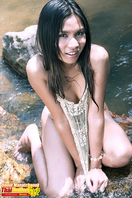 Attractive Thai slut gf woman Donut Manatchanok gets totally naked in a shallow brook