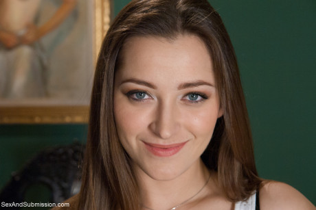 Pretty secretary Dani Daniels drops her nylons to show her massive butt at work
