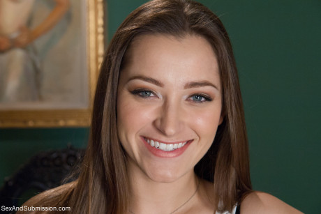 Pretty secretary Dani Daniels drops her nylons to show her massive butt at work