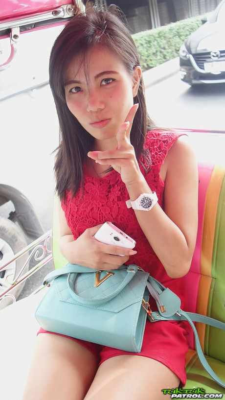 Lovely oriental Wan shows off her thin body while undressing for sex