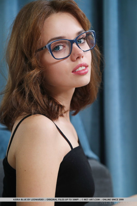 Geeky teen Keira Blue gets unprotected naked on a sofa over a glass of wine