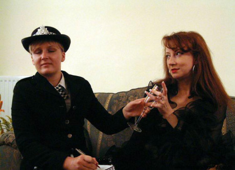 Redheaded girl indulges in lesbian foreplay with a British policewoman