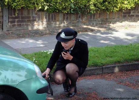 Redheaded girl indulges in lesbian foreplay with a British policewoman