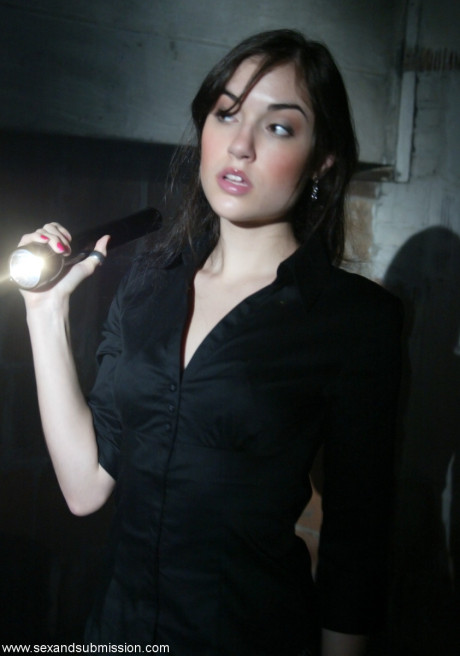 Brunette journalist Sasha Grey gets a rough face fuck in the armory at night