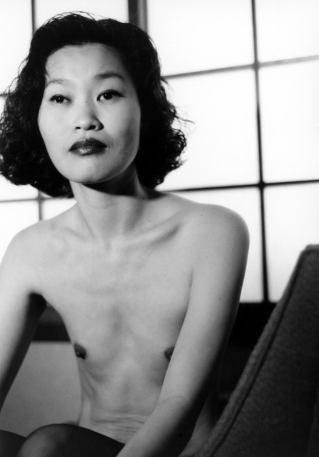 Asian babe shows her petite body & her tiny tits in a ebony & white scene