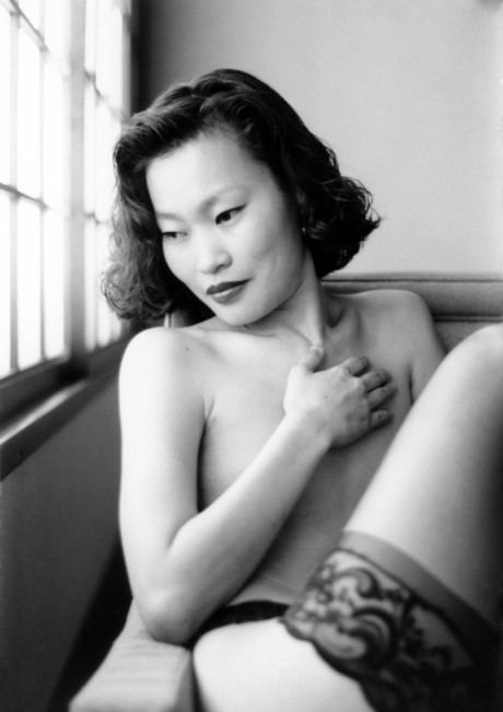 Asian babe shows her petite body & her tiny tits in a ebony & white scene