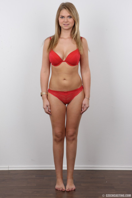 Appealing fresh teen amateur Dominika posing in various stages of undress