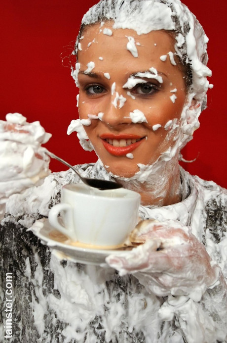 Fully clothed ladies completely cover each other in whipped cream