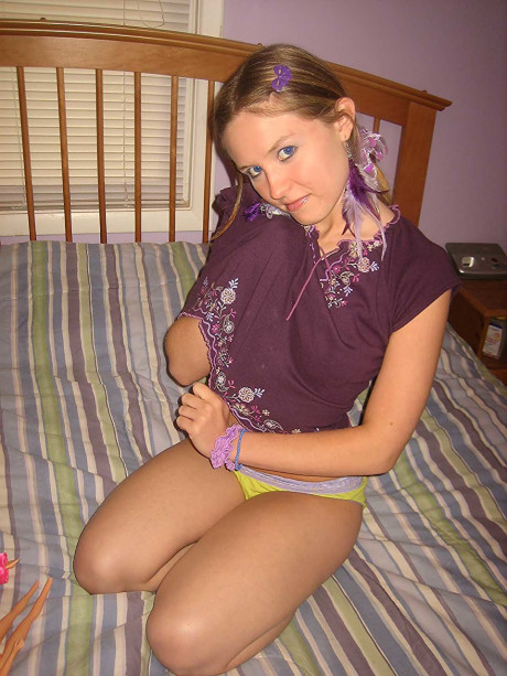 Sweet brunette Kitty strips and toys herself after playing with Barbies