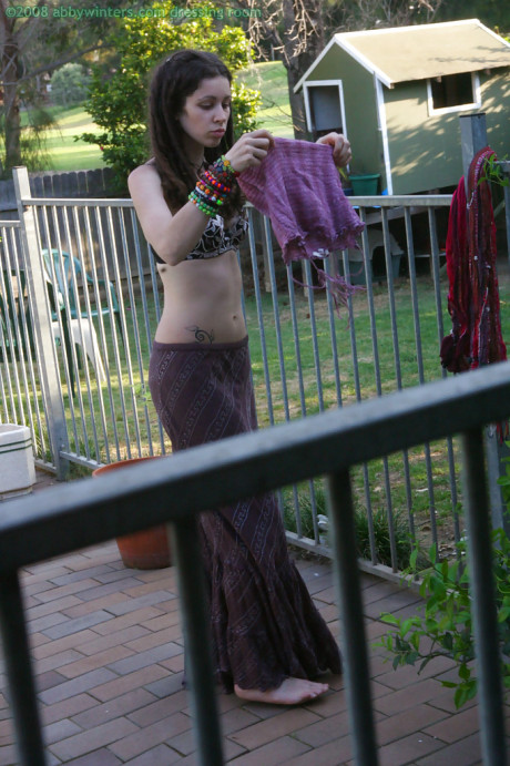 Horny brunette amateur Elyse getting dressed after masturbating