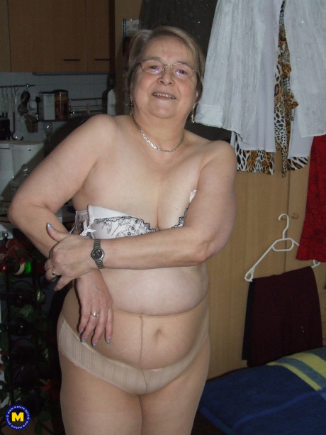 Meaty European old lady Sybille stripping off her clothes and skin tone tights