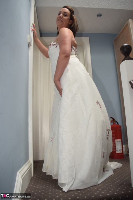 Amateur lady Sara Banks as her tits and cunt freed from a gown by two men