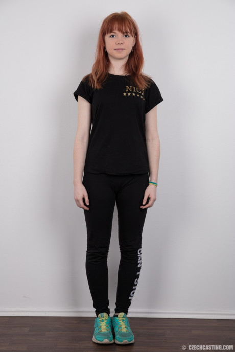 Charming red hair amateur uncovers her barely budding boobies as she gets undressed