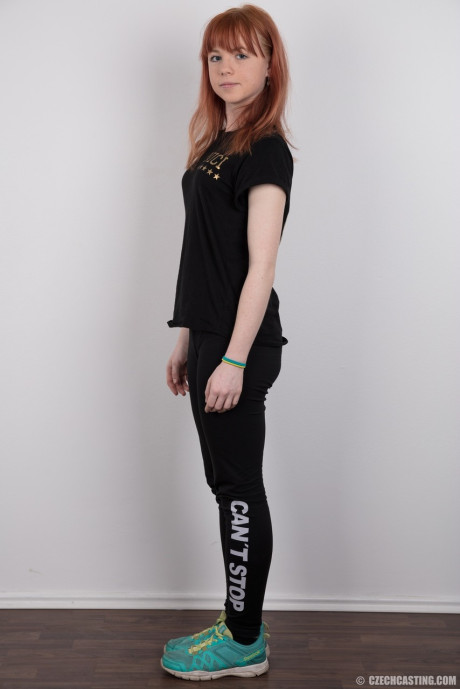 Charming red hair amateur uncovers her barely budding boobies as she gets undressed