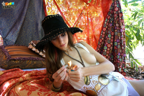 Hippy whore lady Willow Hayes bares her titties before smoking weed in the outdoors