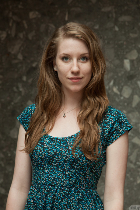 Pretty teenie Olivia Pelton gets rid of her red panties while posing in a dress