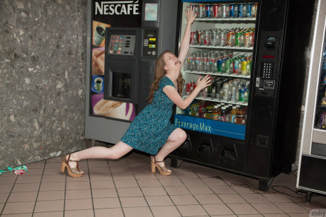 Pretty teenie Olivia Pelton gets rid of her red panties while posing in a dress