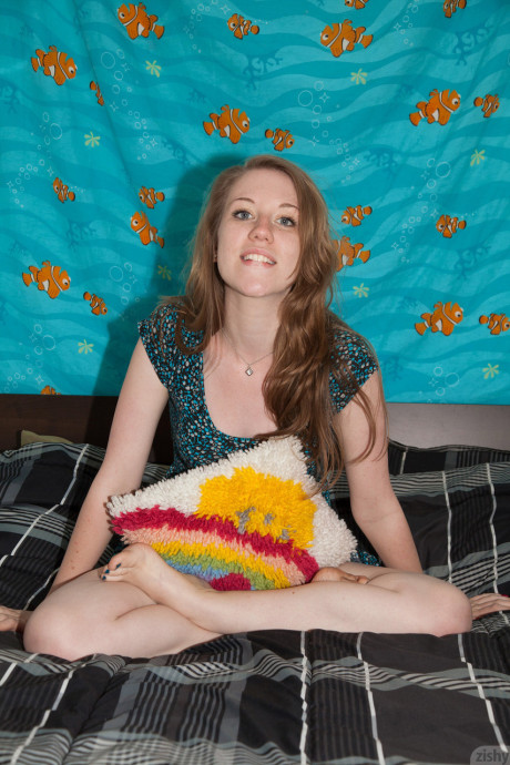 Pretty teenie Olivia Pelton gets rid of her red panties while posing in a dress