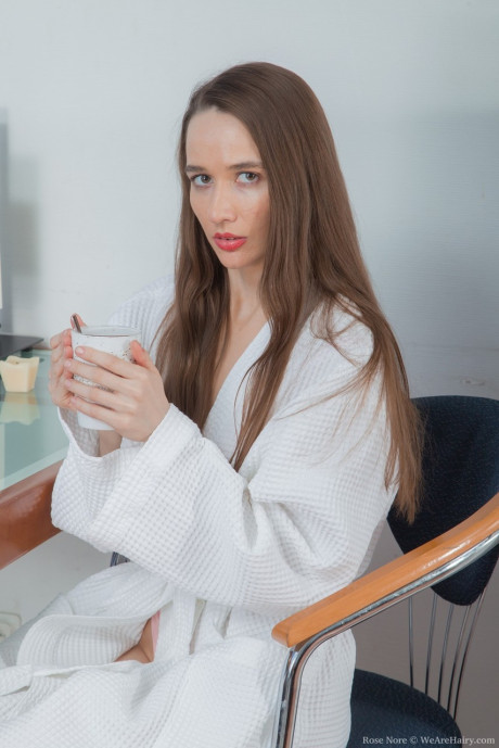 Slim amateur Rose Nore spreads her bushy vagina after shedding robe and undies