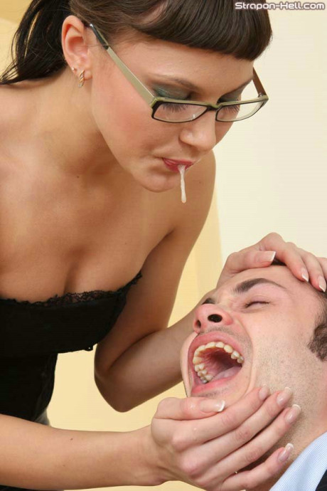 Dominant broad spits in a man boyfriend lover mouth before pegging him with a enormous strapon