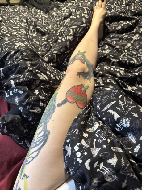 Tattooed amateur with purple hair and glasses takes selfies in the nude