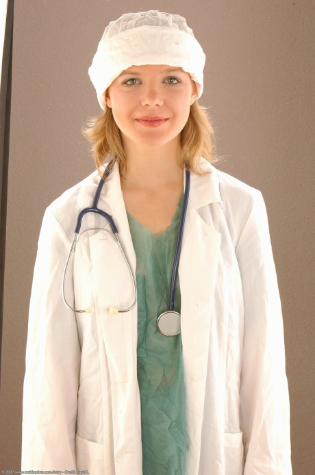 Pretty female doctor Lena inserts a speculum during a close-up show