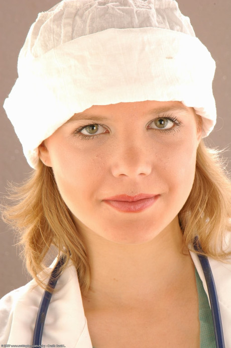 Pretty female doctor Lena inserts a speculum during a close-up show