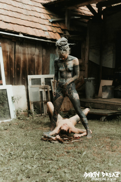 Heavily tattooed hoes piss on a undressed fiance bf lover outside the back steps of a house