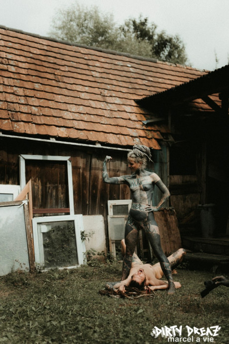 Heavily tattooed hoes piss on a undressed fiance bf lover outside the back steps of a house