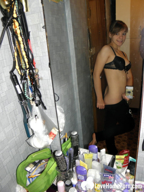 Hot teen with natural breasts undresses and takes lovely homemade selfies