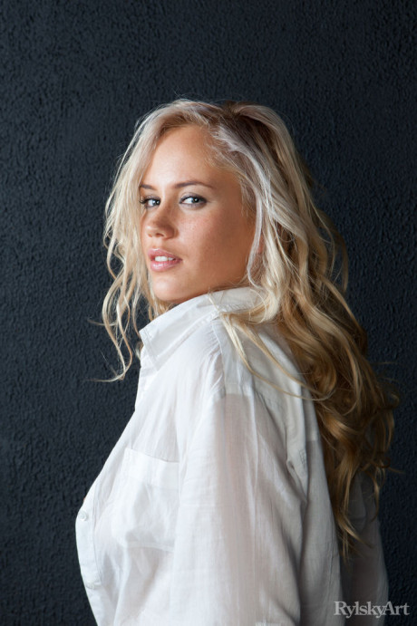 Hot blonde Paige shows a cute lovely pair of small hard nipples on firm full breasts