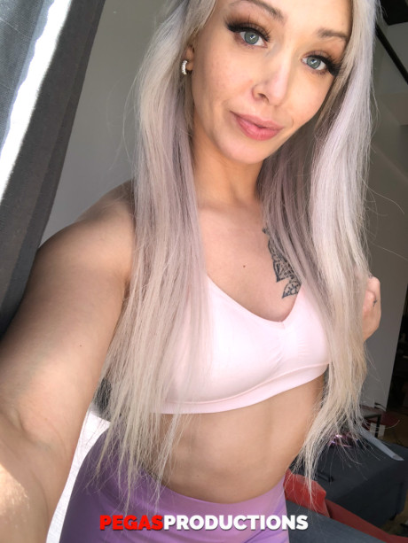 Yellow-haired teen Kate Brixxton loses her hot stockings & lingerie to pose