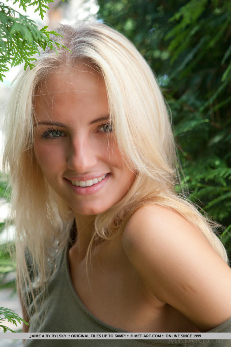 Fresh teenie yellow-haired female Jaime A stripping off clothes to model undressed outdoors
