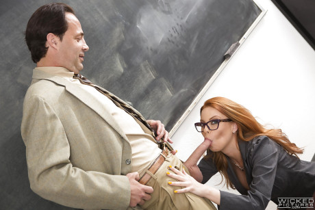 Nerdy ginger head teacher Britney Amber sucking rod and balls in classroom