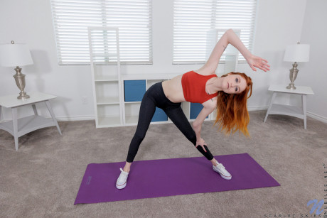 Natural ginger head Scarlet Skies finger spreads her young pussy after doing yoga