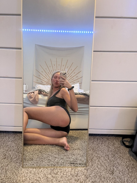 Cute blondy teenie Kayla Pufff takes selfies during a glamour shoot
