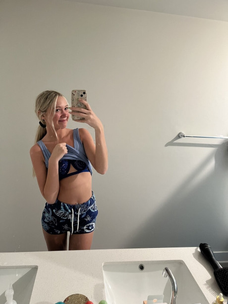 Cute blondy teenie Kayla Pufff takes selfies during a glamour shoot