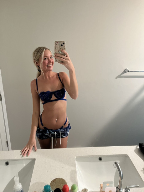 Cute blondy teenie Kayla Pufff takes selfies during a glamour shoot