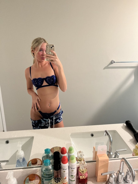 Cute blondy teenie Kayla Pufff takes selfies during a glamour shoot