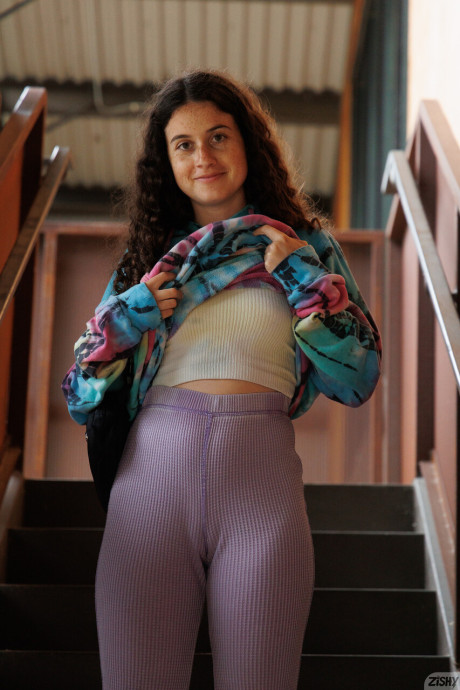 Ravishing attractive curly haired babe Gabriella Noren shows her tiny boobs and her enormous butt