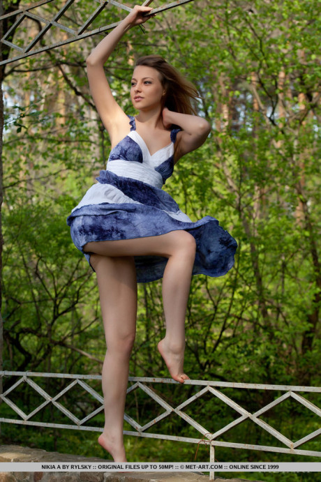 Smiley faced young Nikia A removing dress for outdoor glamour spread