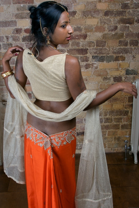 Indian model with tattoos exposes her firm breasts in traditional clothing