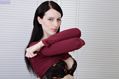 Dark haired young Alex parts her bushy cunt lips after stripping nude