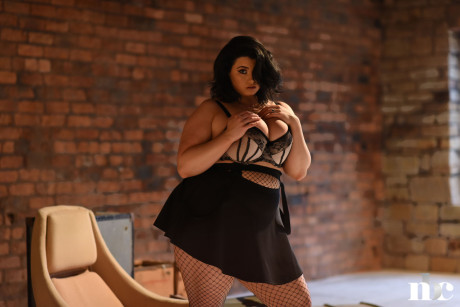 Chubby gorgeous whore woman Kiki lets out her giant juggs wearing a short skirt