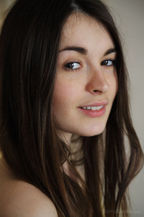 Brunette teenie Lukki Lima peels off her underwear wearing a smiley face