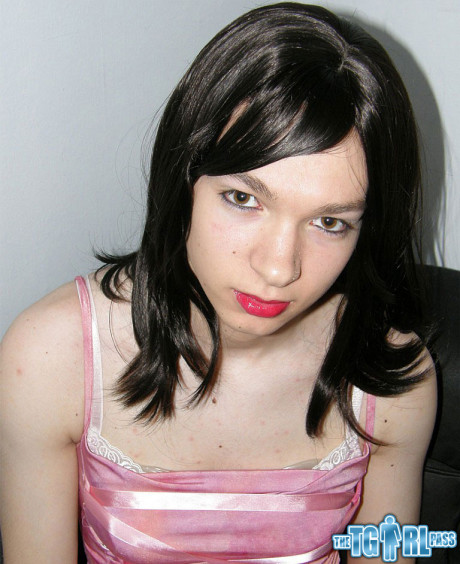 Petite transexual showing off that slender body of hers in a pink dress