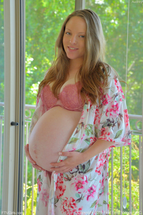 Pregnant babe Audrey loses panties and toys her delicious vagina on the bed